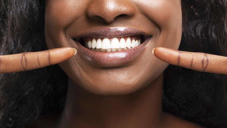 A woman with a bright smile on her face