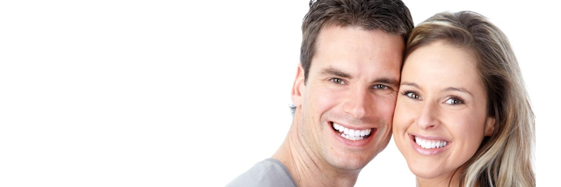 Couple smiling after teeth whitening in Northborough, MA